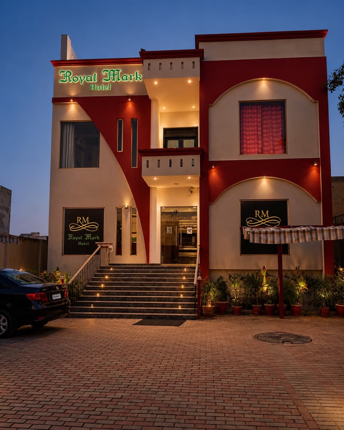 Royal Mark Hotel — the illuminated facade and entrance at dusk